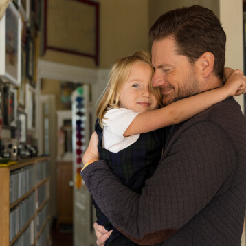 dad preparing child for first day of school