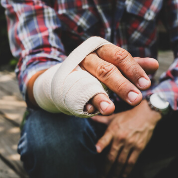 injured hand with a wrapped splint